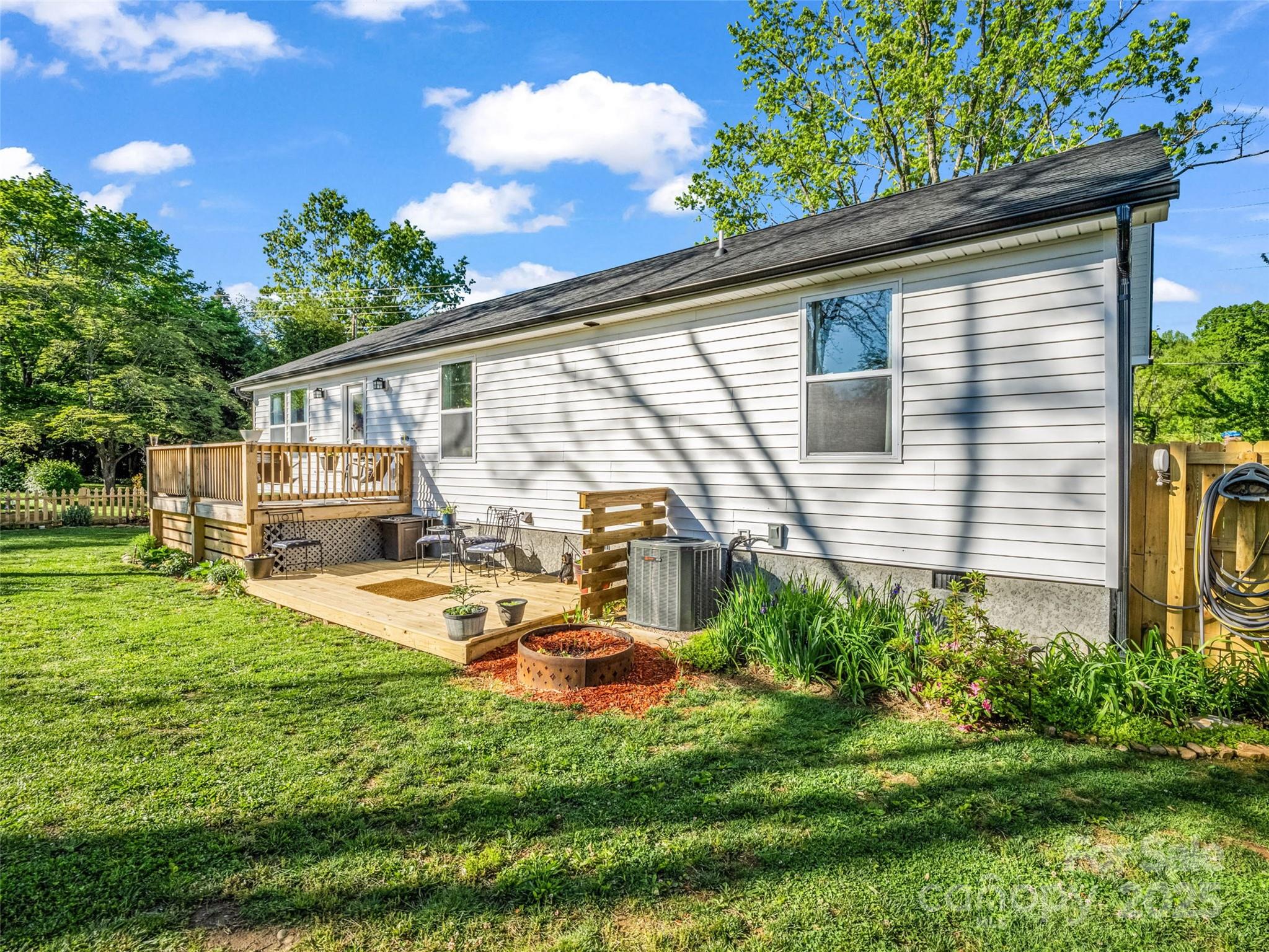 566 Blue Ridge Road Black Mountain, NC 28711 - Photo 12 of 41 a front view of a house with garden