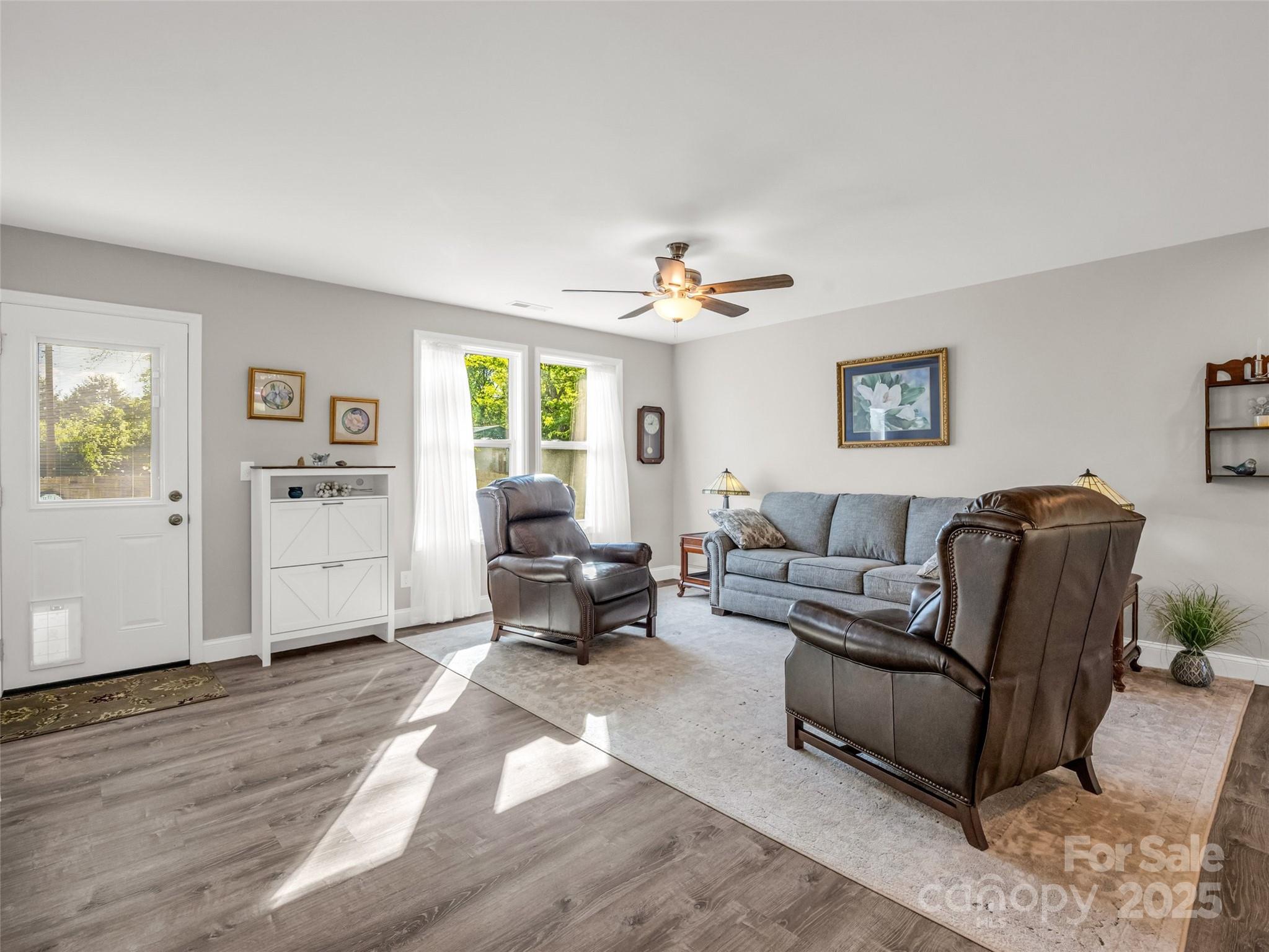 566 Blue Ridge Road Black Mountain, NC 28711 - Photo 18 of 41 a living room with furniture and a wooden floor