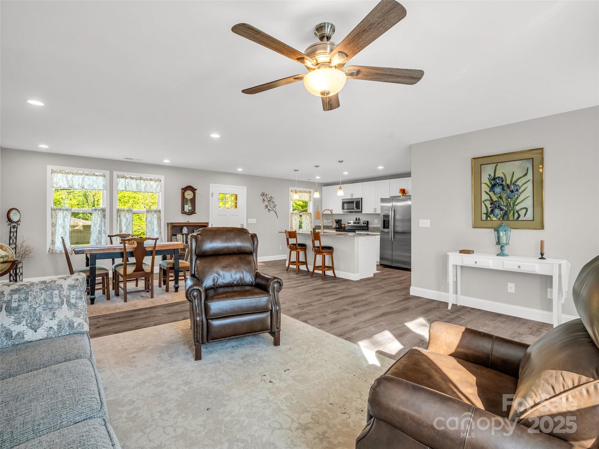 566 Blue Ridge Road Black Mountain, NC 28711 - Photo 20 of 41 a living room with furniture and kitchen view