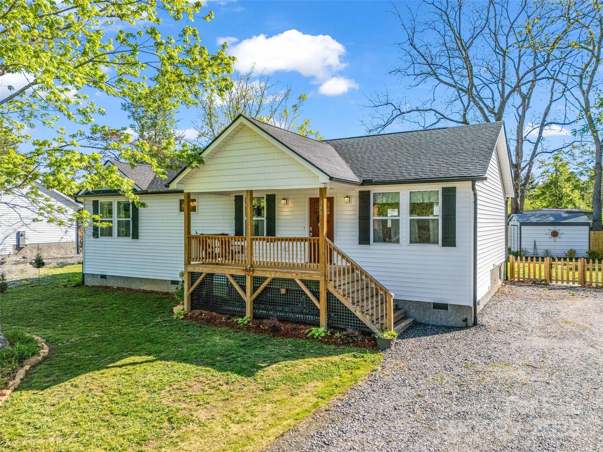 566 Blue Ridge Road Black Mountain, NC 28711 - Photo 3 of 41 a view of a house with a yard