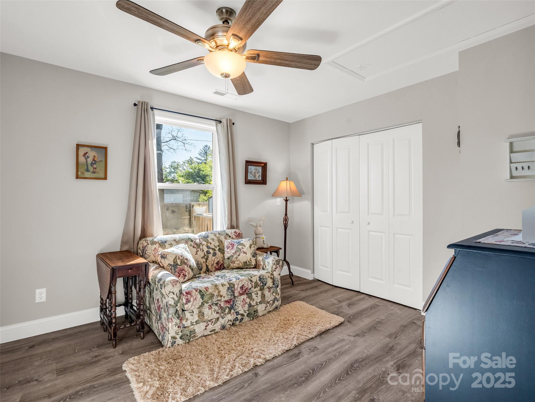566 Blue Ridge Road Black Mountain, NC 28711 - Photo 33 of 41 a living room with furniture and a large window