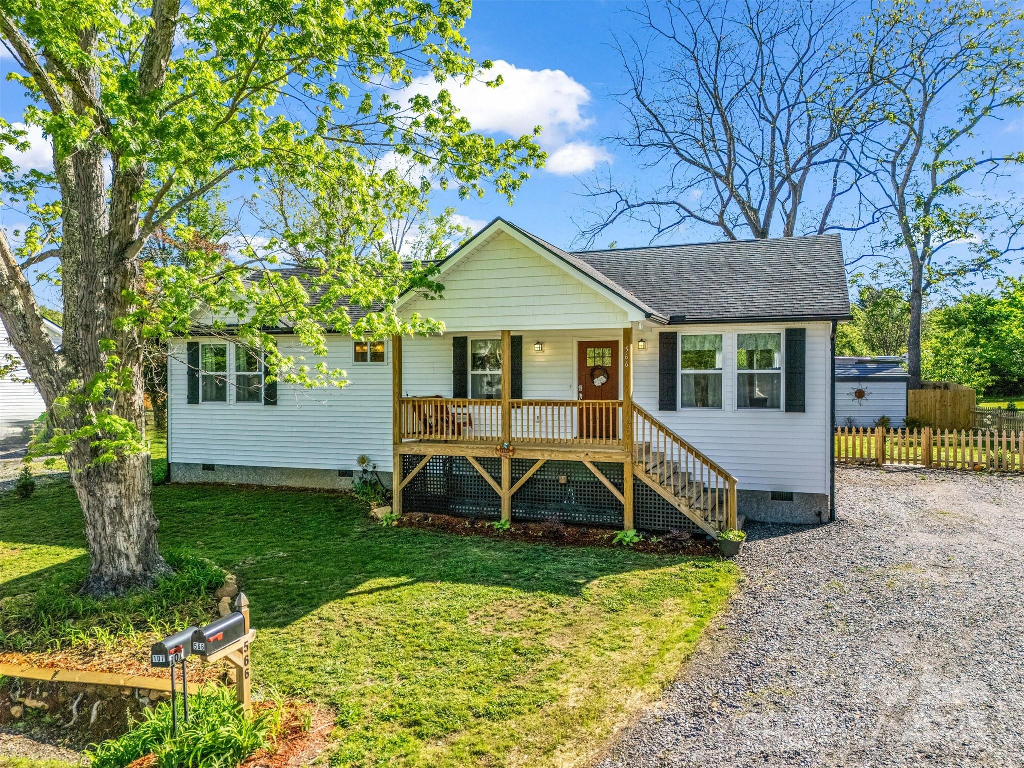 566 Blue Ridge Road Black Mountain, NC 28711 - Photo 4 of 41 a front view of a house with garden