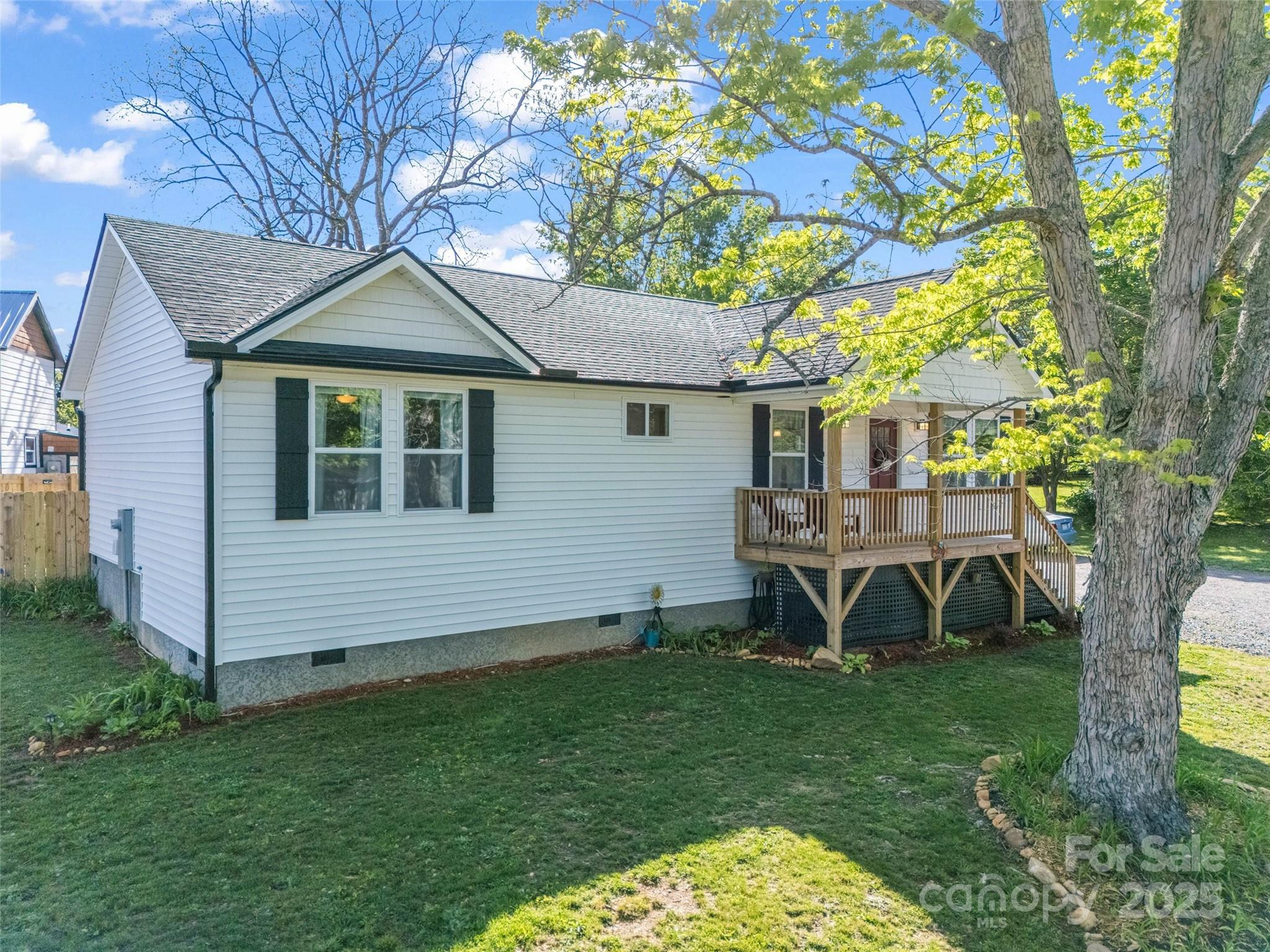 566 Blue Ridge Road Black Mountain, NC 28711 - Photo 8 of 41 a front view of a house with garden