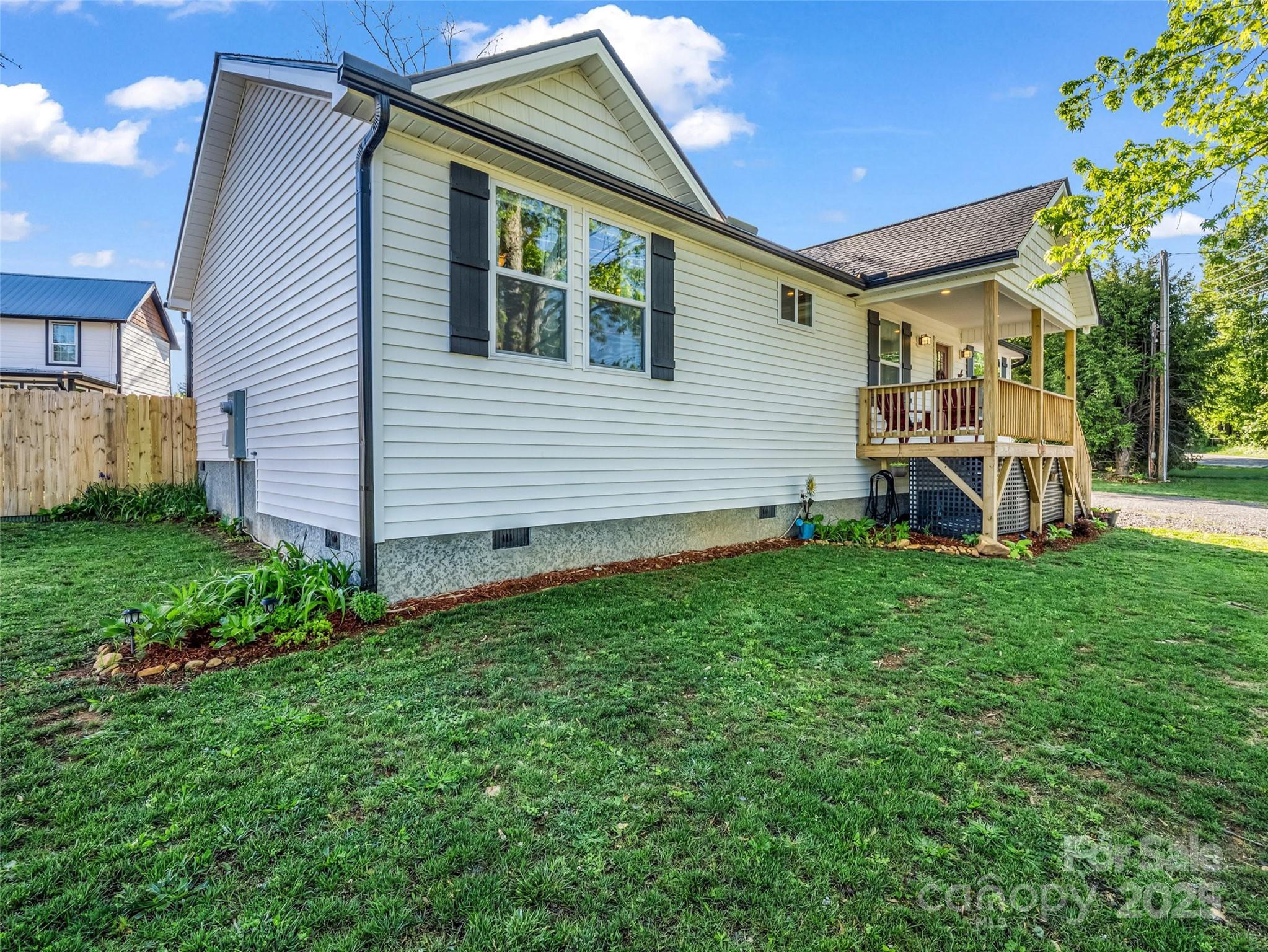 566 Blue Ridge Road Black Mountain, NC 28711 - Photo 9 of 41 a view of a house with a backyard