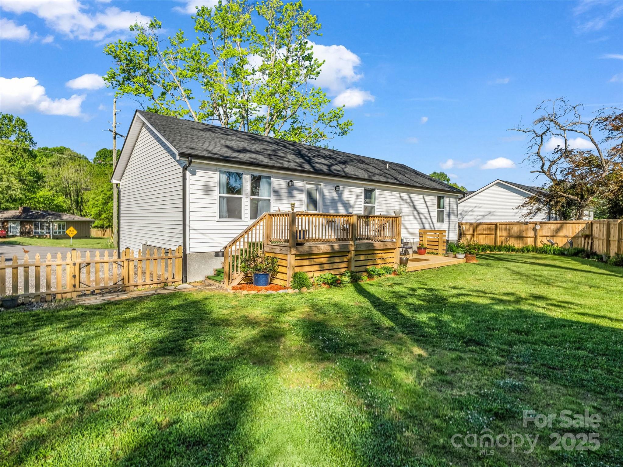 566 Blue Ridge Road Black Mountain, NC 28711 - Photo 10 of 41 a view of a house with a yard