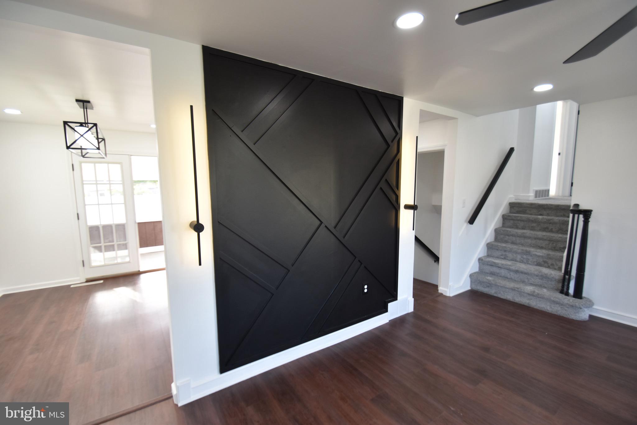 6 Russell Road New Castle, DE 19720 - Photo 3 of 16 a view of an entryway with wooden floor and door