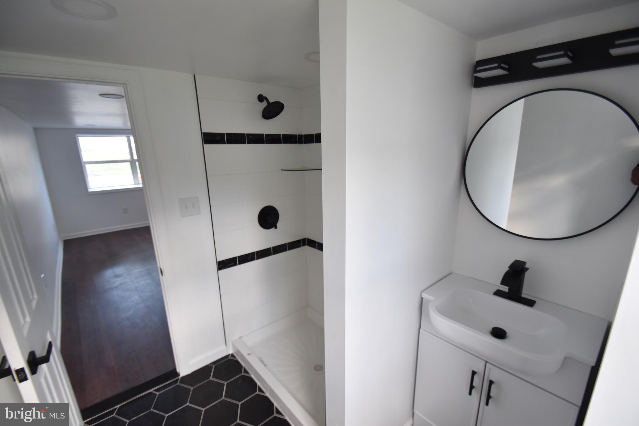 6 Russell Road New Castle, DE 19720 - Photo 10 of 16 a bathroom with a sink and a mirror