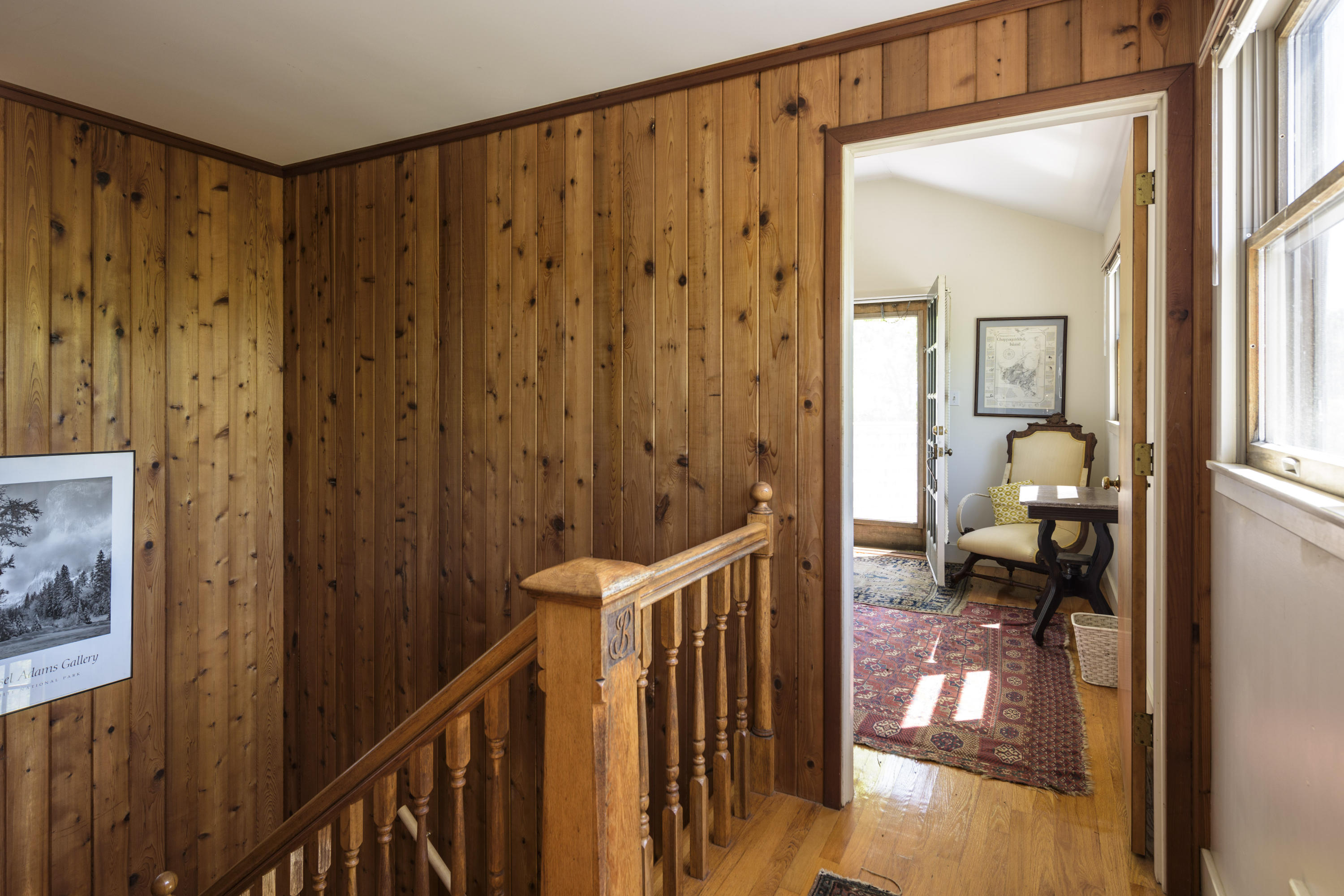 56 Green Pastures Road Edgartown, MA 02539 - Photo 21 of 35 a view of a hallway with wooden floor and stairs