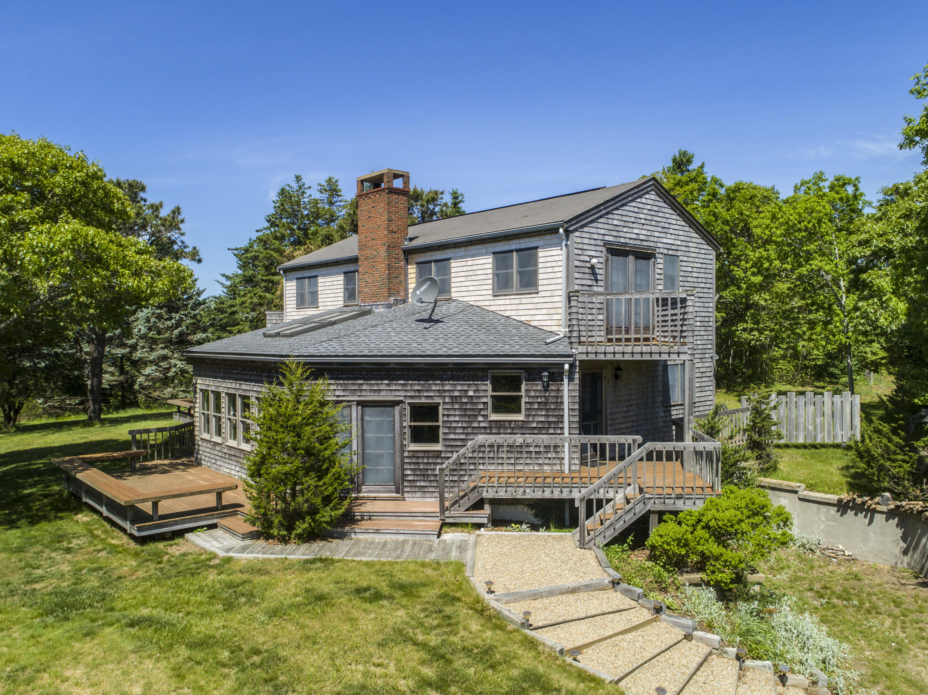 56 Green Pastures Road Edgartown, MA 02539 - Photo 4 of 35 a front view of a house with garden