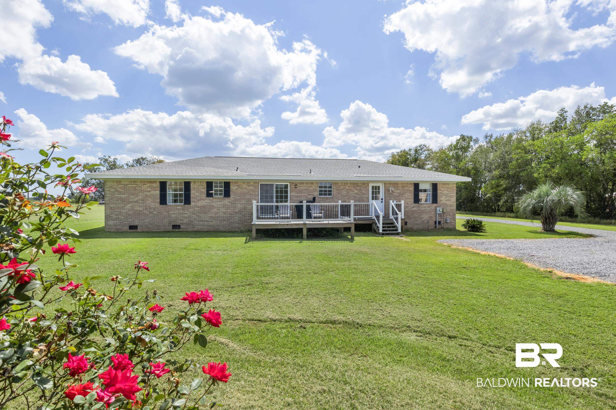 17689 Brewer Road Foley, AL 36535 - Photo 40 of 54 View of front of home featuring a front yard and a wooden deck