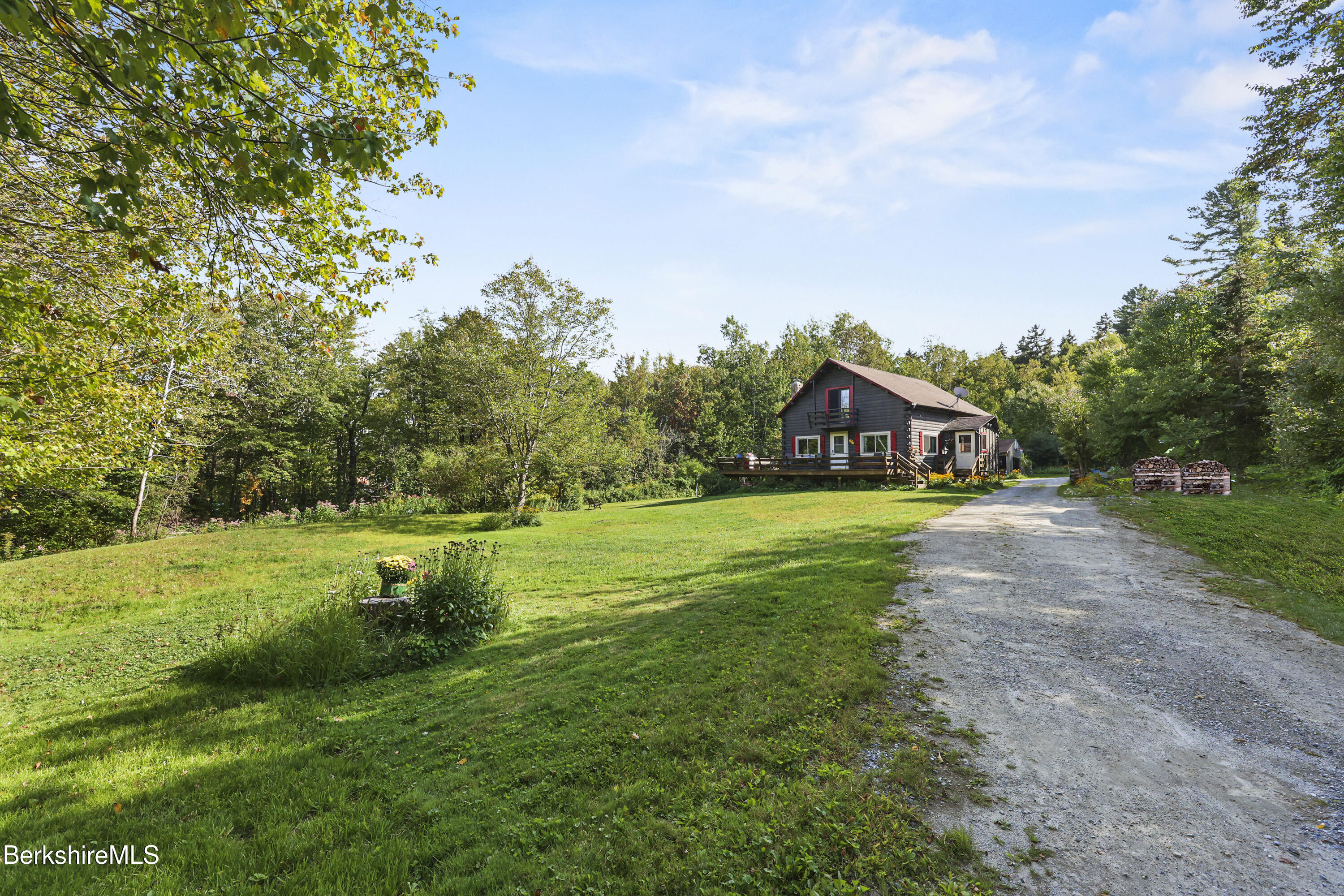 78 East Main Road Peru, MA 01235 - Photo 1 of 56 a view of a house with a big yard and large trees