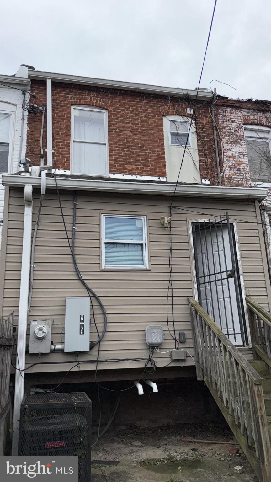 2586 West Fayette Street Baltimore, MD 21223 - Photo 7 of 17 a front view of a house with balcony