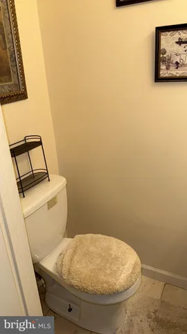 a bathroom with a toilet and a sink