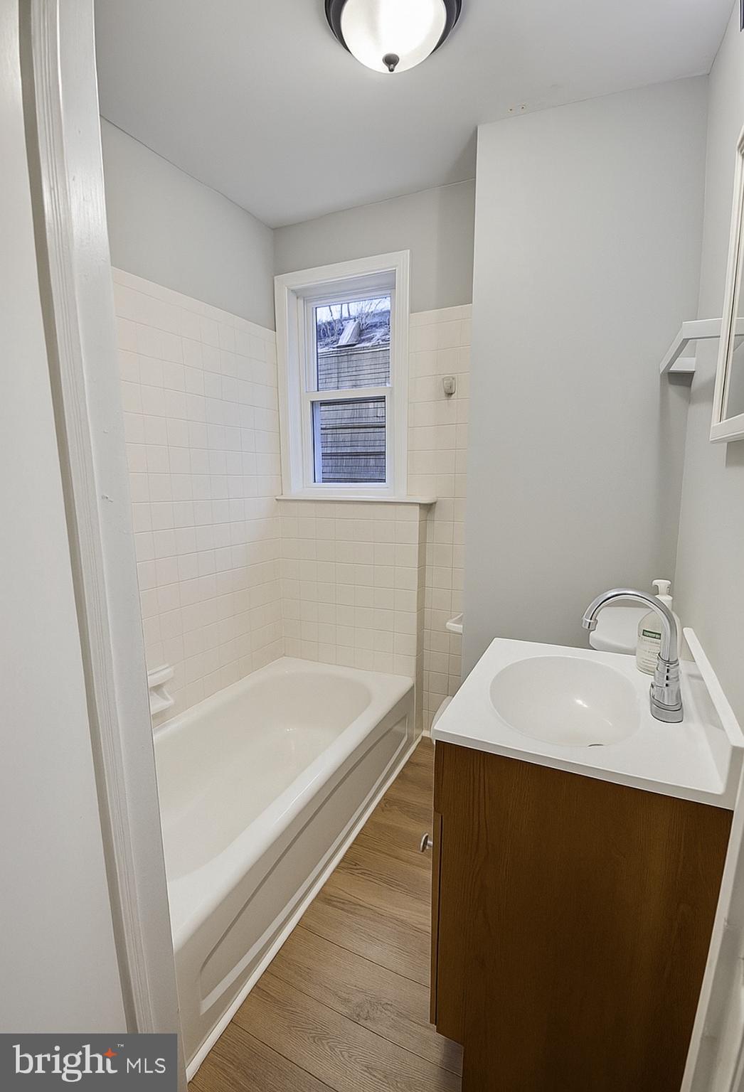 112 Old Rose Street Trenton, NJ 08618 - Photo 3 of 7 a bathroom with a sink and a bathtub