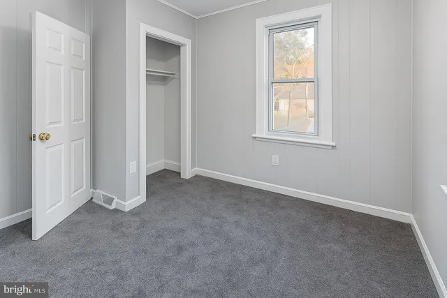 an empty room that has a window