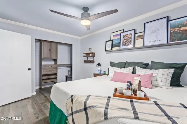 a bedroom with a bed and a dresser