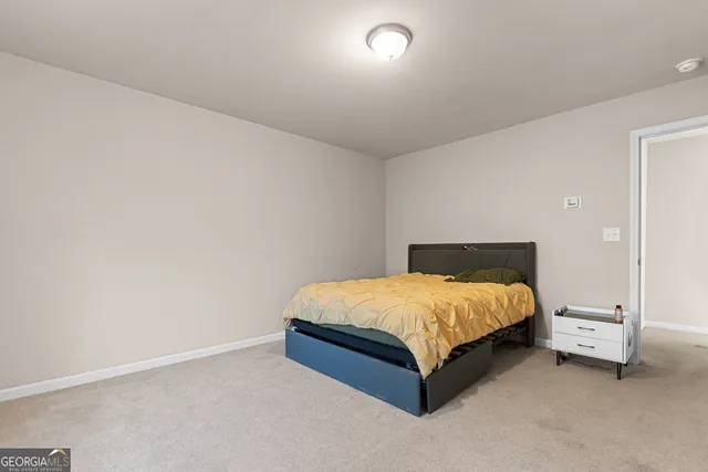 a bed sitting in a room