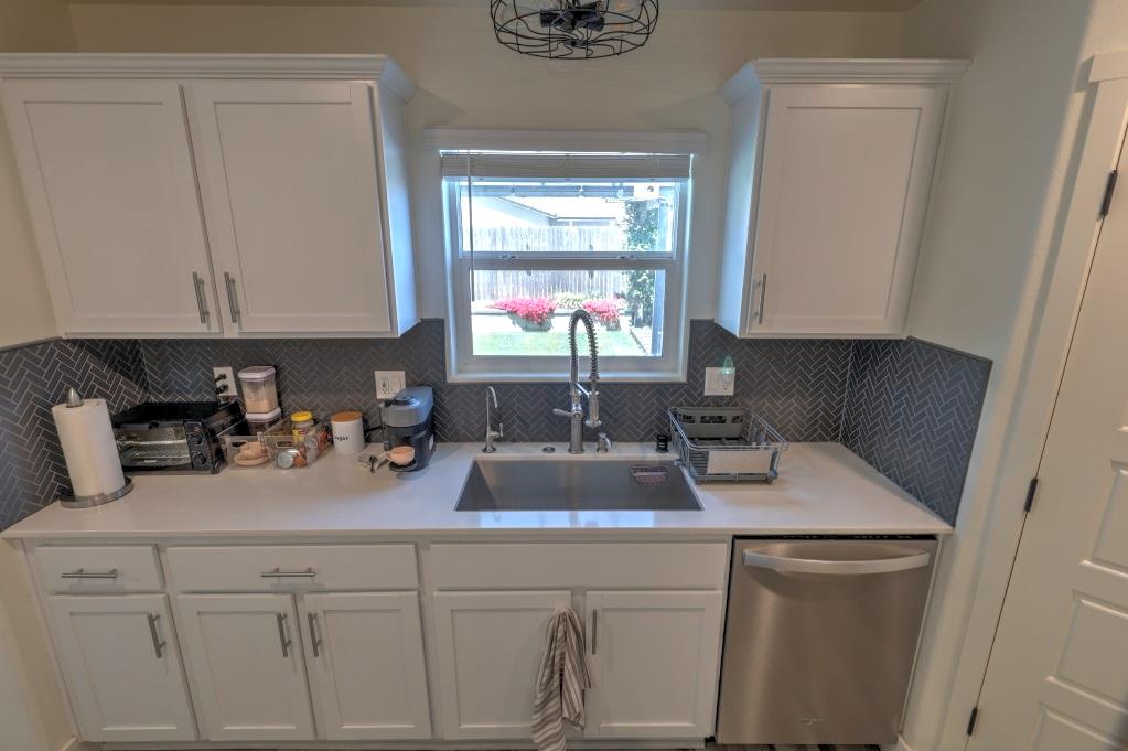 2129 Redding Way Atwater, CA 95301 - Photo 17 of 75 a kitchen with a sink cabinets and window
