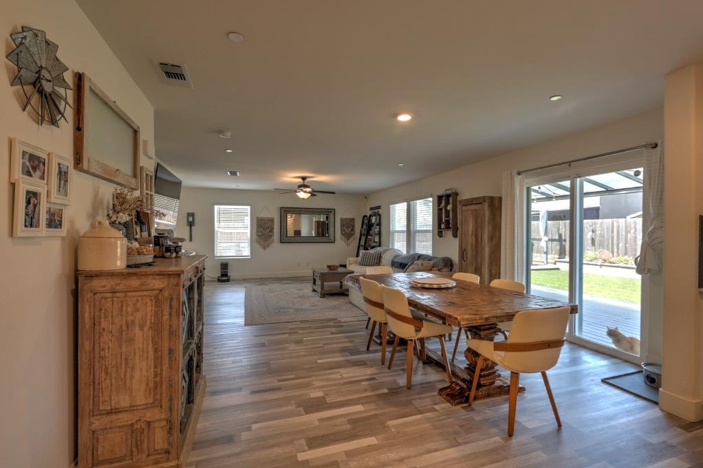 2129 Redding Way Atwater, CA 95301 - Photo 20 of 75 a view of a dining room with furniture window and wooden floor