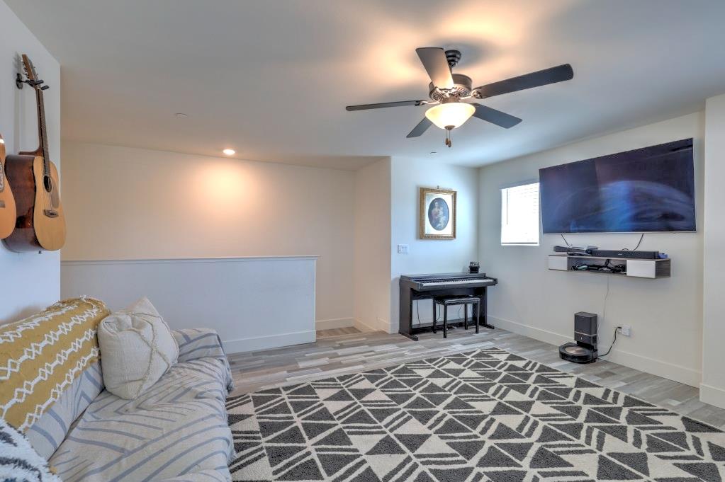 2129 Redding Way Atwater, CA 95301 - Photo 25 of 75 a living room with furniture a flat screen tv and a ceiling fan