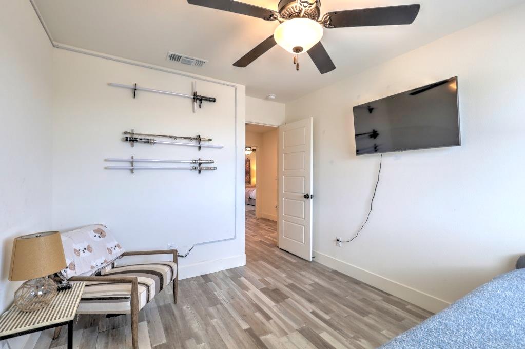 2129 Redding Way Atwater, CA 95301 - Photo 29 of 75 a view of a hallway with a flat screen tv