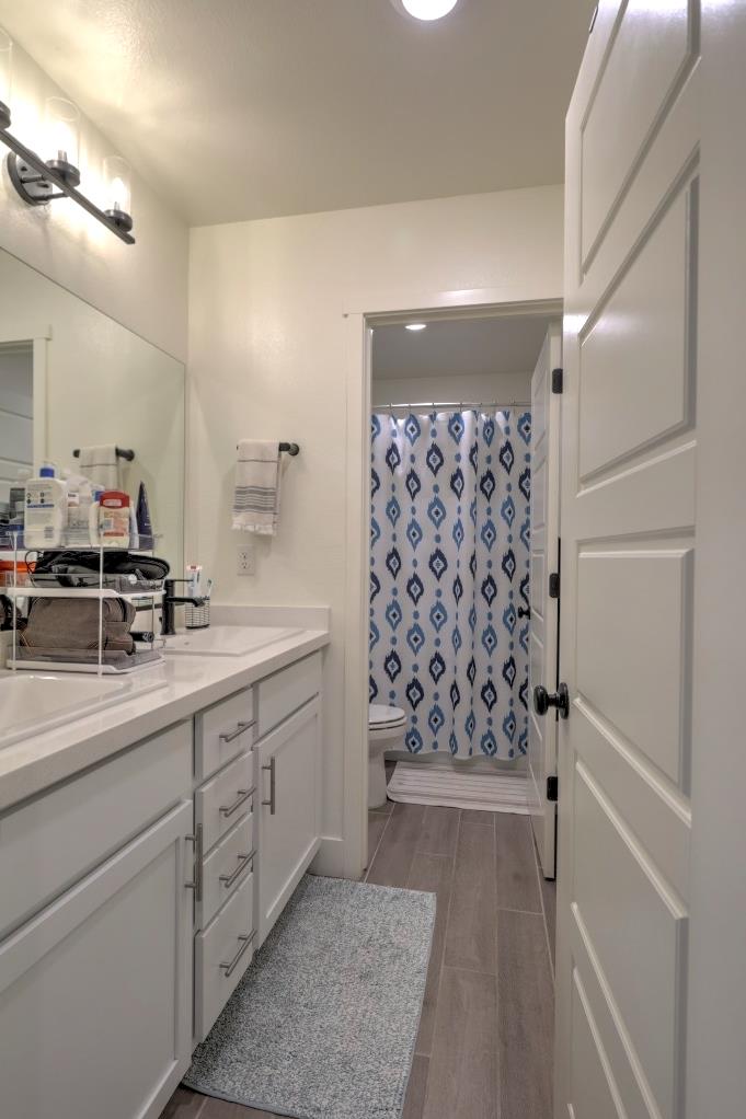 2129 Redding Way Atwater, CA 95301 - Photo 37 of 75 a bathroom with a shower and a sink