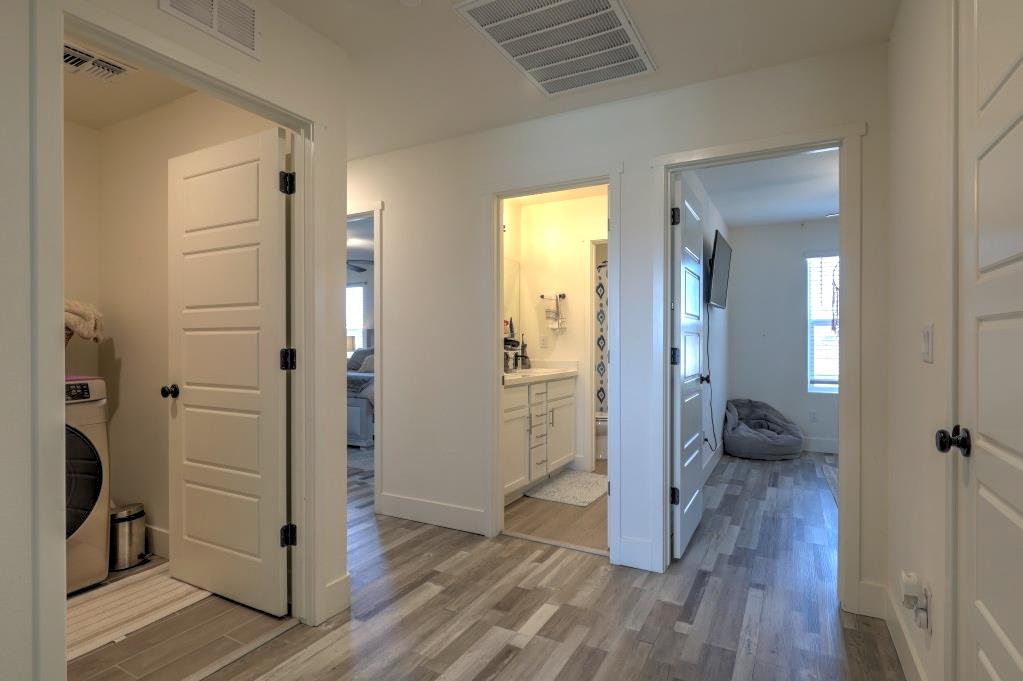 2129 Redding Way Atwater, CA 95301 - Photo 38 of 75 a view of a hallway with wooden floor and closet