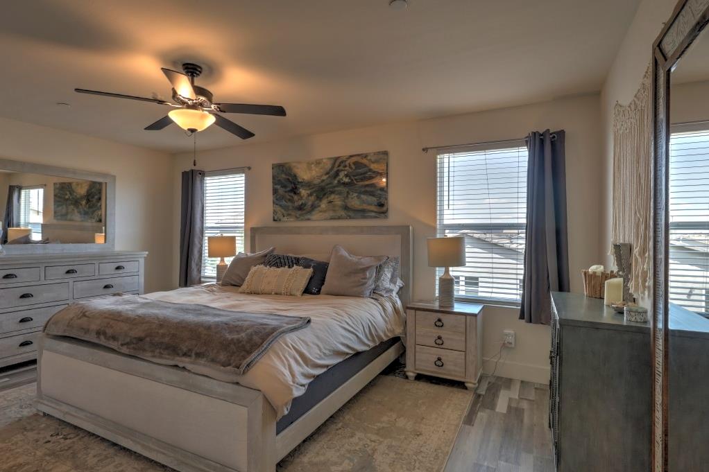 2129 Redding Way Atwater, CA 95301 - Photo 39 of 75 a bedroom with a large bed and a chandelier