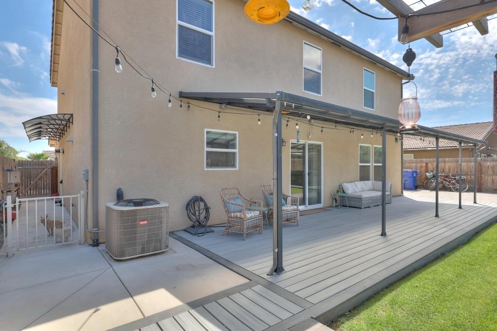 2129 Redding Way Atwater, CA 95301 - Photo 53 of 75 a view of a patio with couple of chairs and potted plants