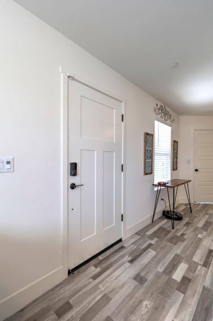 2129 Redding Way Atwater, CA 95301 - Photo 61 of 75 a view of a room with wooden floor air conditioner and windows