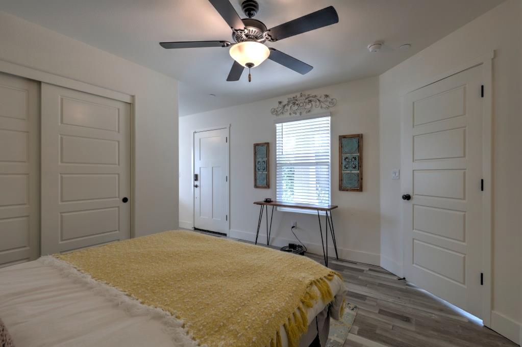 2129 Redding Way Atwater, CA 95301 - Photo 66 of 75 a bedroom with a bed and a chandelier