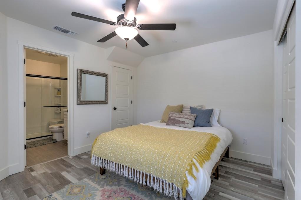 2129 Redding Way Atwater, CA 95301 - Photo 67 of 75 a bedroom with a bed and a chandelier