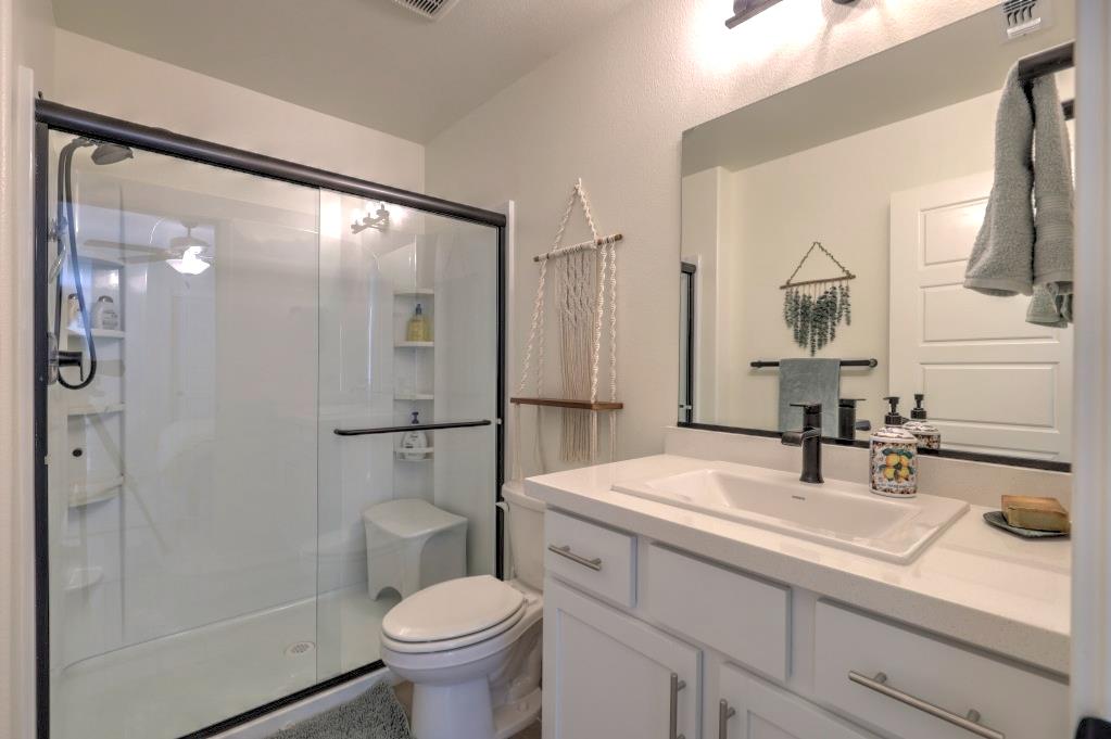 2129 Redding Way Atwater, CA 95301 - Photo 68 of 75 a bathroom with a sink toilet and shower