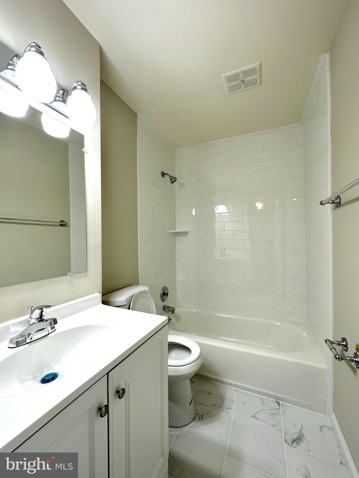 402 Carousel Court Gaithersburg, MD 20877 - Photo 25 of 29 a bathroom with a sink a toilet and shower