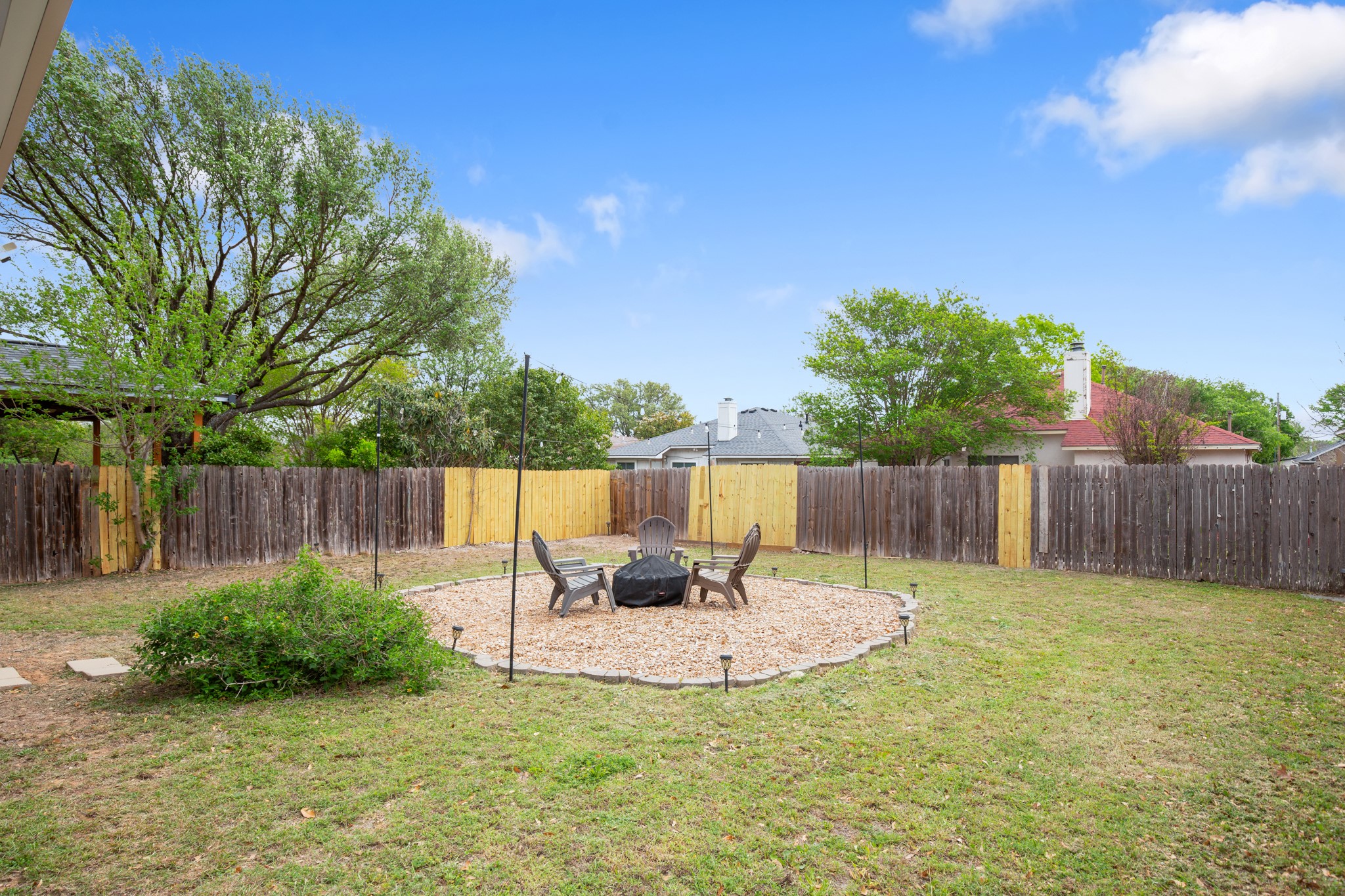 13803 Randalstone Drive Pflugerville, TX 78660 - Photo 4 of 27 Fenced backyard featuring a patio area and an outdoor fire pit