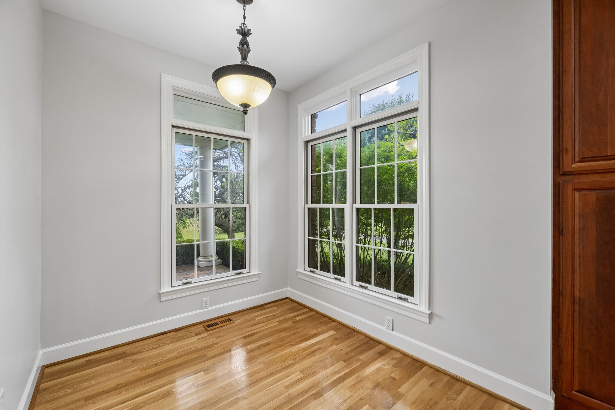 314 Fairview Road Dickson, TN 37055 - Photo 16 of 81 a view of an empty room with wooden floor and a window