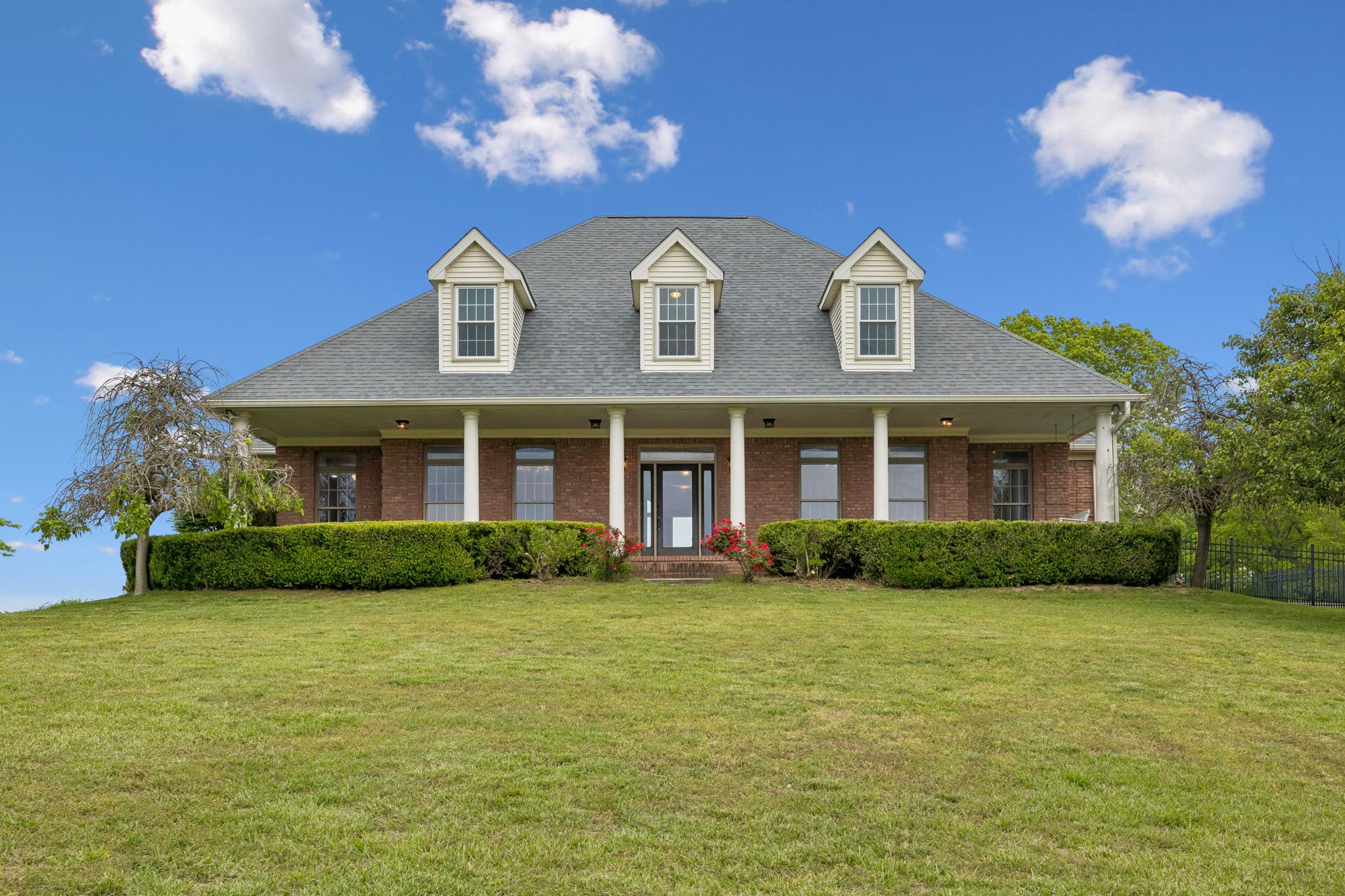 314 Fairview Road Dickson, TN 37055 - Photo 2 of 81 a view of a brick house with a yard