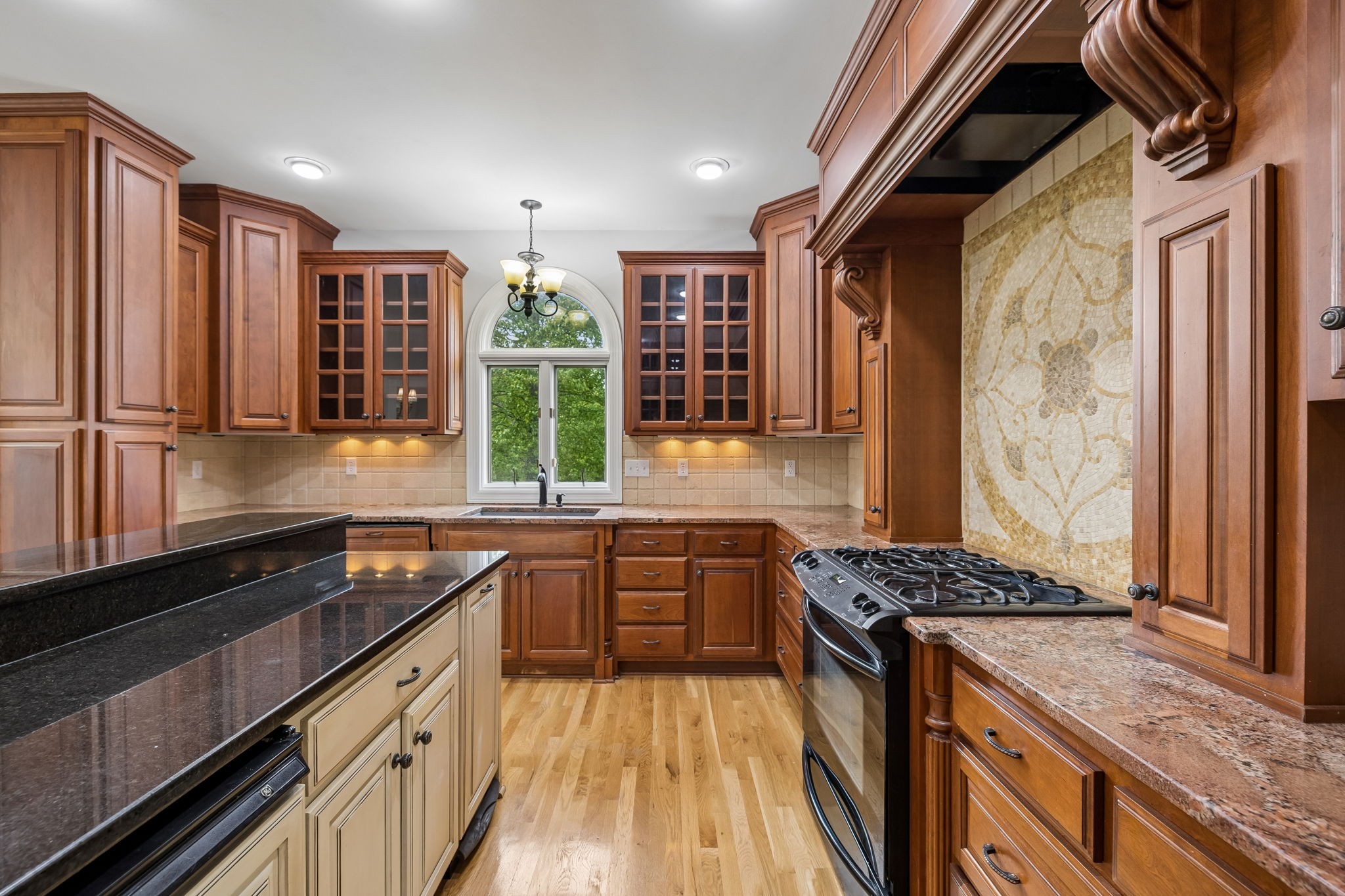 314 Fairview Road Dickson, TN 37055 - Photo 21 of 81 a kitchen with granite countertop a sink stove and refrigerator