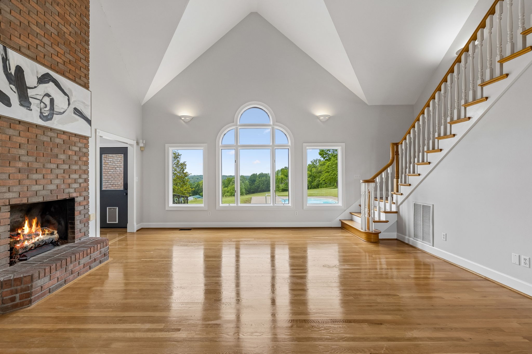 314 Fairview Road Dickson, TN 37055 - Photo 27 of 81 a view of empty room with wooden floor fireplace and a window