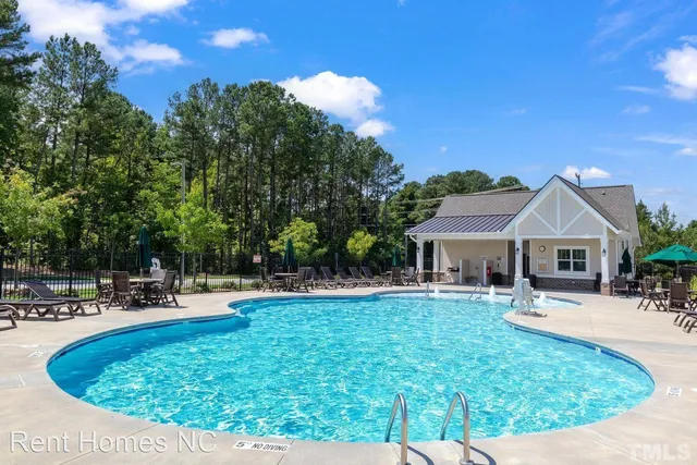 a view of a house with outdoor seating