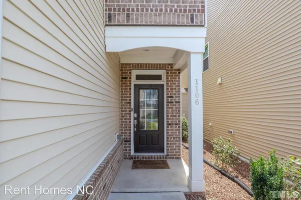 a front view of a house with a door