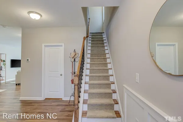a view of entryway with wooden floor