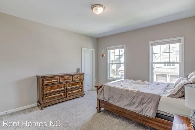 a bed room with a bed and a window