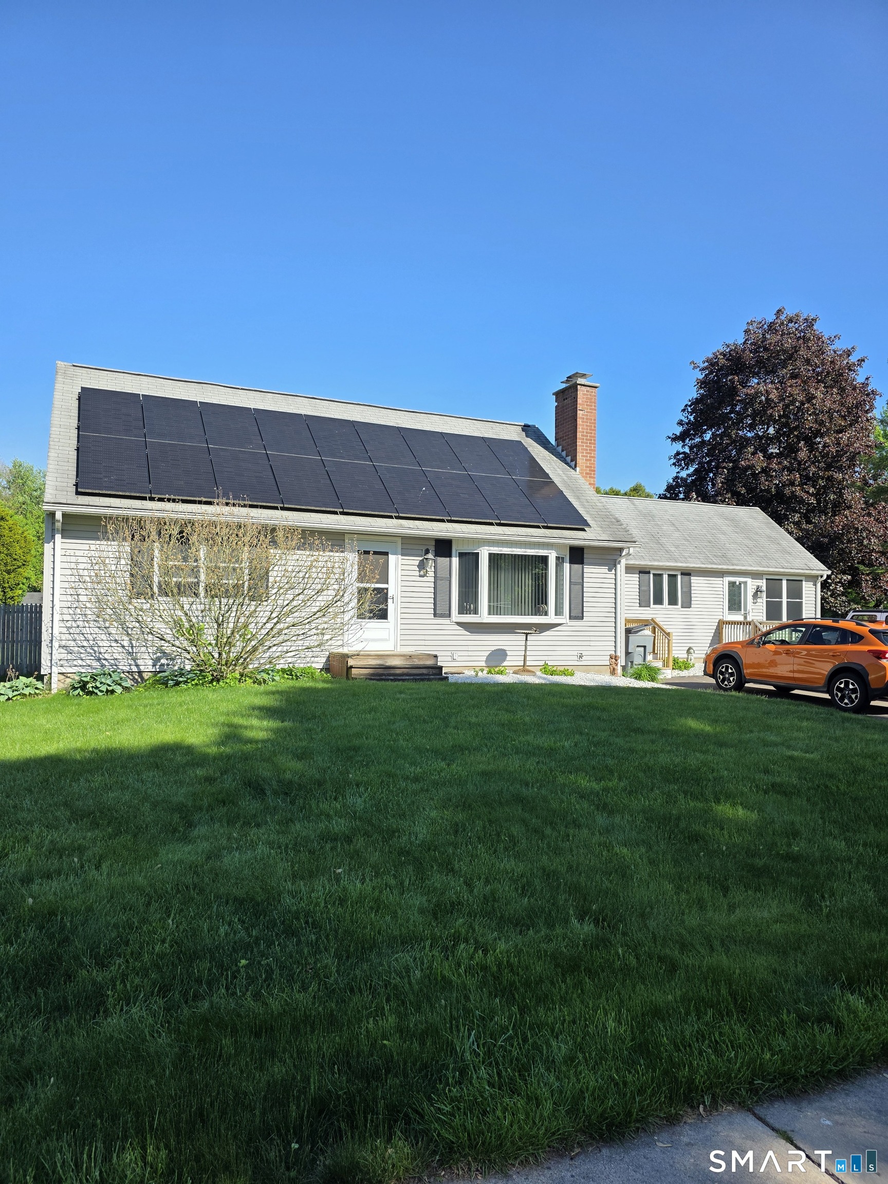 15 Van Buren Road Enfield, CT 06082 - Photo 14 of 40 a front view of a house with a garden