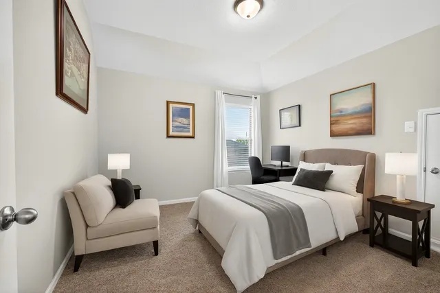 a bedroom with a bed and a couch