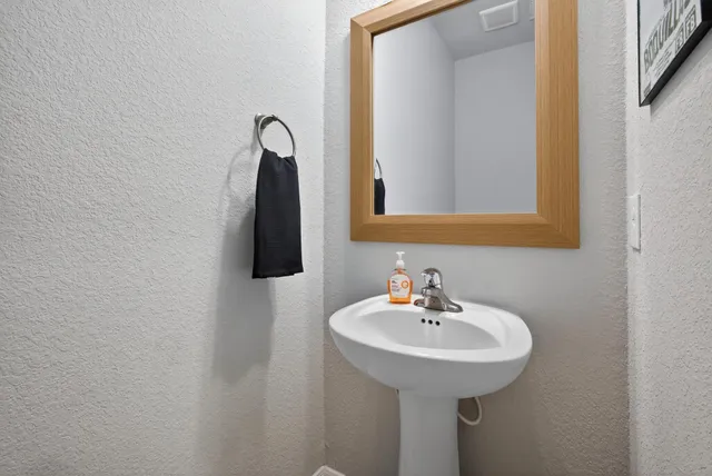 a bathroom with a sink and a mirror