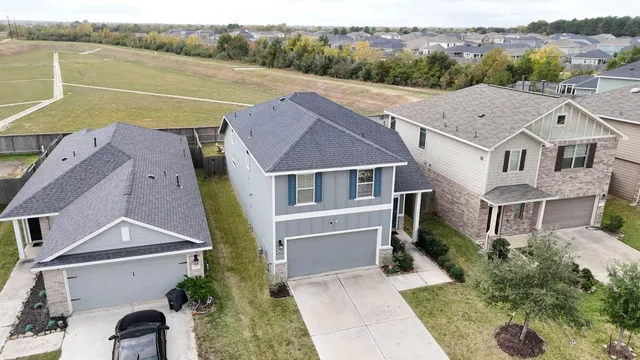a aerial view of a house with a ocean view