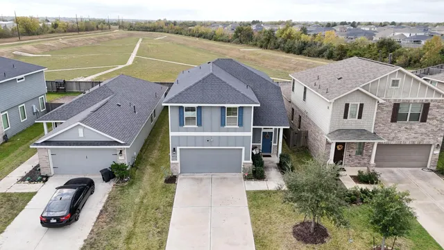 an aerial view of residential houses with outdoor space