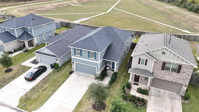 an aerial view of houses with outdoor space