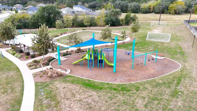 a view of a swimming pool with a yard